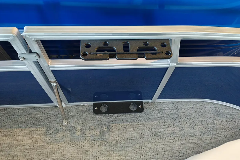 Slide: The Image of 2026 Sun Tracker Bass Buggy 16 XL Select pontoon boat interior detail with blue paneling. - 9