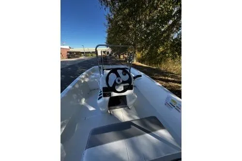 Slide: The Image of 2026 Mako Pro Skiff 17 CC boat interior with steering wheel and console. - 5