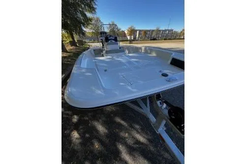 Slide: The Image of 2026 Mako Pro Skiff 17 CC boat on trailer, parked outdoors. - 6