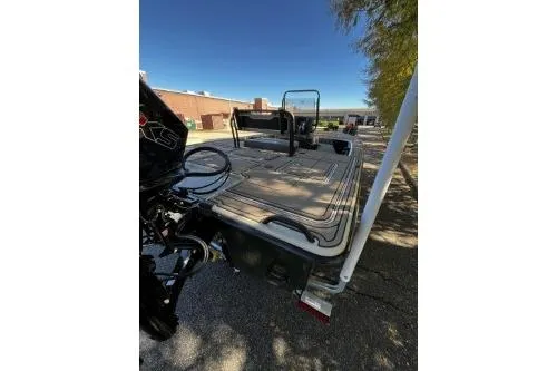 Slide: The Image of 2026 Mako 18 Pro Skiff Backwater Edition boat, rear view, parked outdoors. - 4