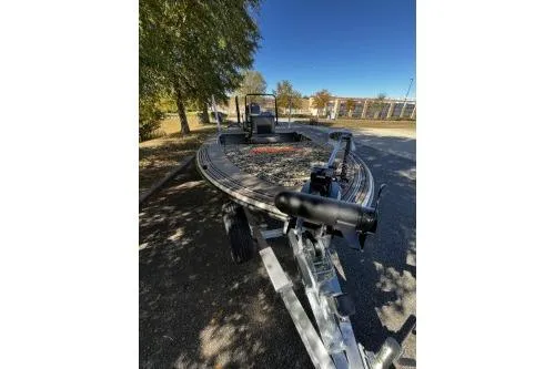 Slide: The Image of 2026 Mako 18 Pro Skiff Backwater Edition boat on trailer, parked outdoors. - 5