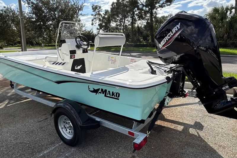 Slide: The Image of 2026 Mako Pro Skiff 17 CC boat with Mercury engine on trailer. - 10