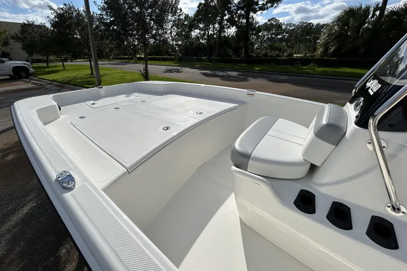 Slide: The Image of 2026 Mako Pro Skiff 17 CC boat interior with seating and storage compartments. - 5