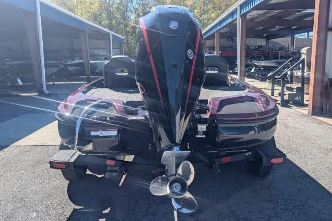 Slide: The Image of 2026 Nitro Z18 Pro boat with powerful outboard motor, parked in a marina. - 107