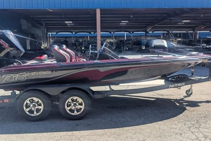 Slide: The Image of 2026 Nitro Z18 Pro boat on trailer, parked outdoors under a blue canopy. - 112