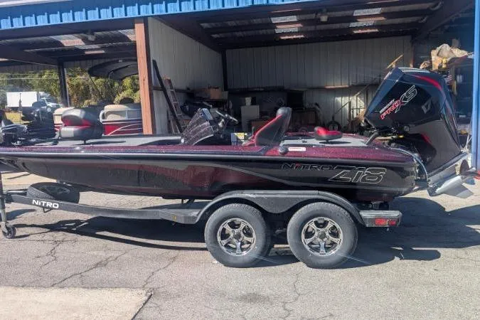 Slide: The Image of Steering wheel and dashboard of 2026 Nitro Z18 Pro boat with Garmin navigation system. - 7
