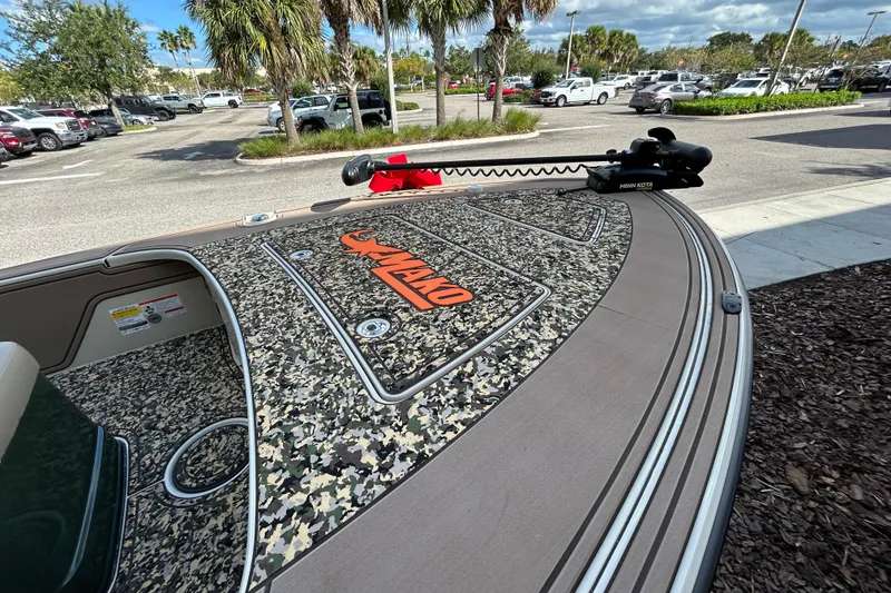 Slide: The Image of 2026 Mako 18 Pro Skiff Backwater Edition with camo deck and Minn Kota trolling motor. - 3