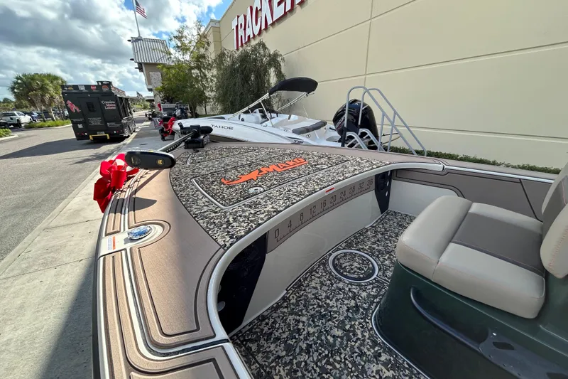 Slide: The Image of 2026 Mako 18 Pro Skiff Backwater Edition displayed outside a dealership. - 4