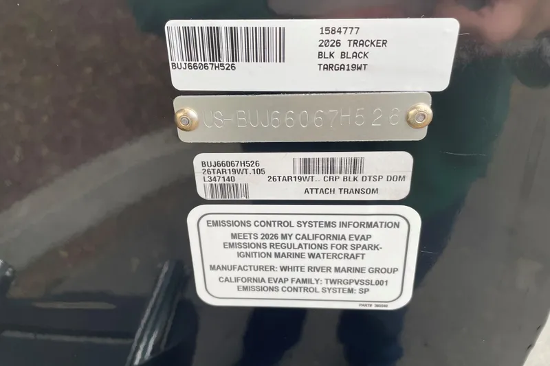 Slide: The Image of 2026 Tracker Targa V-19 WT emissions control label and serial number plate. - 86