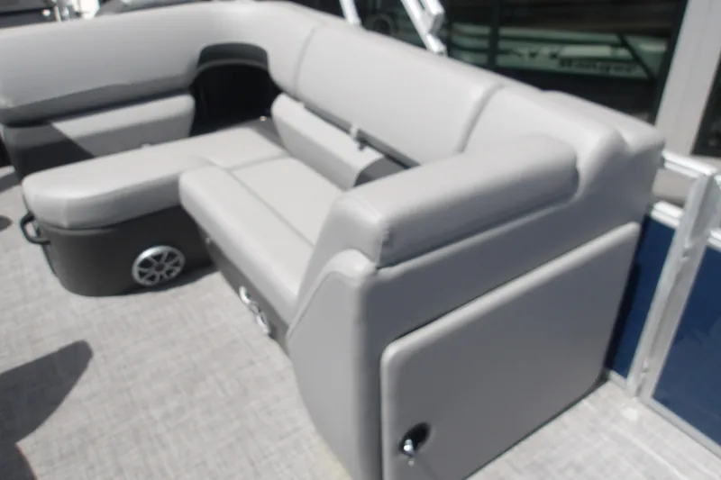 Slide: The Image of 2026 Sun Tracker SportFish 22 XP3 boat interior with gray seating and speaker. - 54