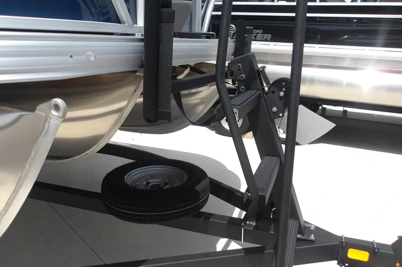 Slide: The Image of 2026 Sun Tracker SportFish 22 XP3 pontoon boat on trailer, close-up view. - 36