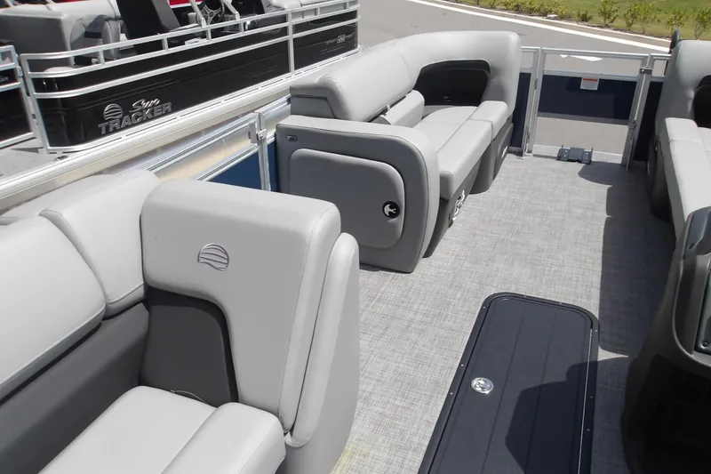 Slide: The Image of 2026 Sun Tracker SportFish 22 XP3 pontoon boat interior with gray seating and spacious layout. - 47