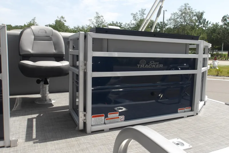 Slide: The Image of 2026 Sun Tracker SportFish 22 XP3 boat interior with seating and railing. - 41