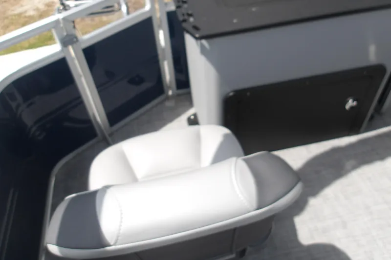 Slide: The Image of Interior view of 2026 Sun Tracker SportFish 22 XP3 boat with seating and storage. - 44