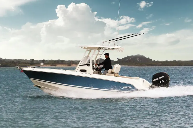 Slide: The Image of Manufacturer Provided Image: 2025 Boston Whaler 230 Outrage cruising on open water under a clear sky. - 2