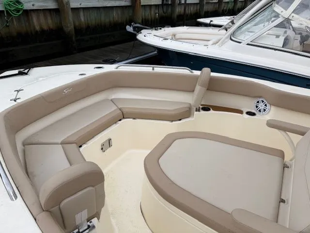 Slide: The Image of 2023 Scout 215 XSF boat interior with beige seating and modern design. - 4