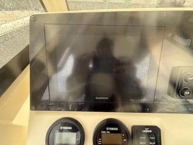 Slide: The Image of 2023 Scout 215 XSF dashboard with Garmin display and Yamaha gauges. - 7