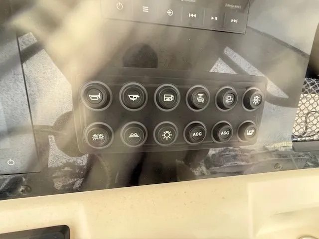 Slide: The Image of Control panel of 2023 Scout 215 XSF boat with various function buttons. - 8