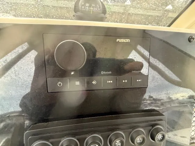 Slide: The Image of 2023 Scout 215 XSF boat dashboard with Fusion Bluetooth audio system. - 9