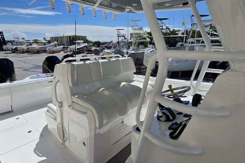 Slide: The Image of 2020 Invincible 35 Catamaran interior with white seating and control panel. - 22