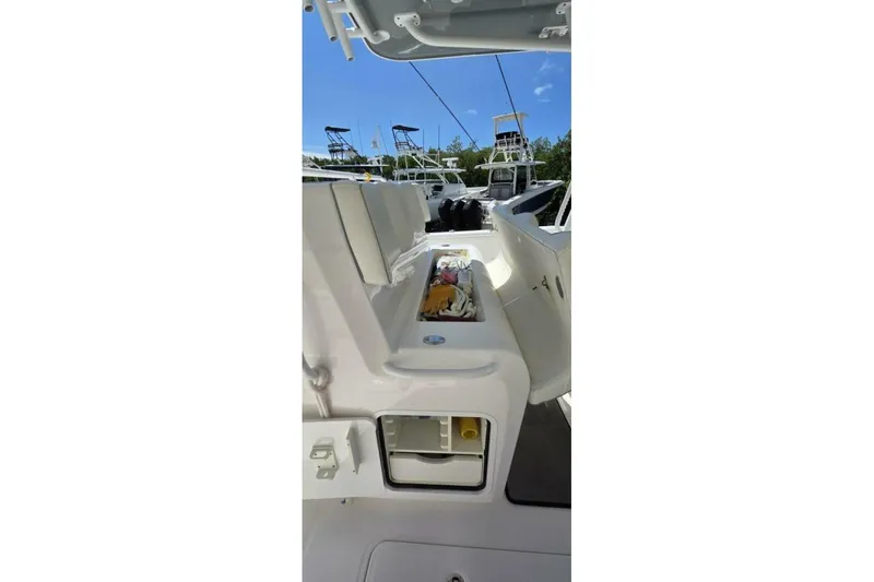 Slide: The Image of 2020 Invincible 35 Catamaran interior view with open storage compartments. - 31