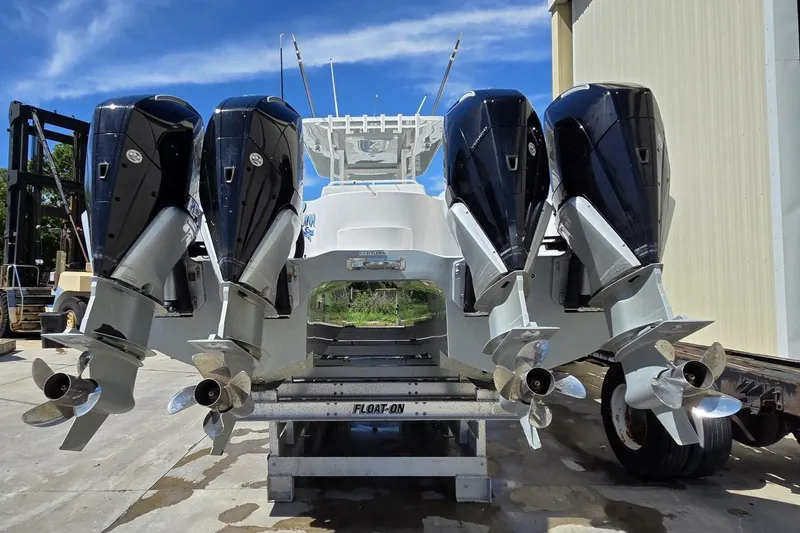 Slide: The Image of 2020 Invincible 35 Catamaran with four powerful outboard engines on a trailer. - 39