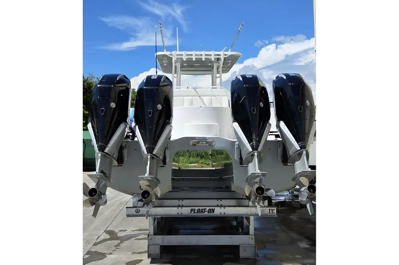 Slide: The Image of 2020 Invincible 35 Catamaran with four powerful outboard engines on a trailer. - 40