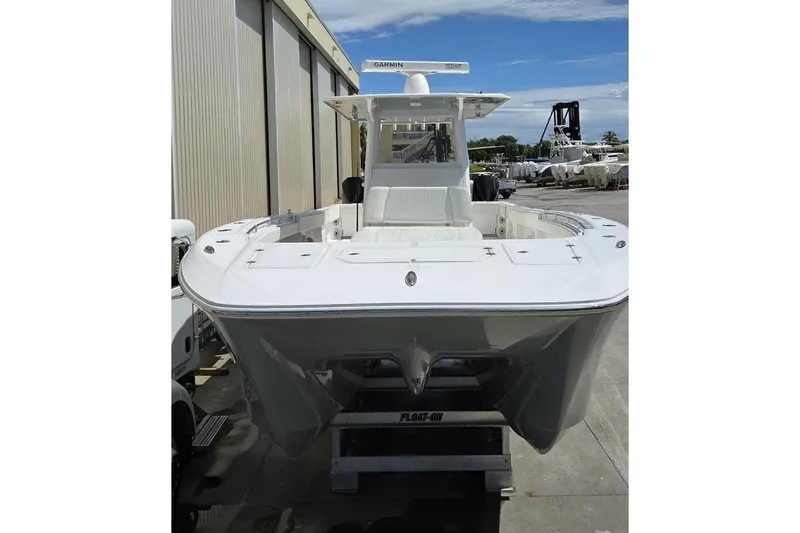 Slide: The Image of 2020 Invincible 35 Catamaran in a boatyard, showcasing sleek design and modern features. - 47