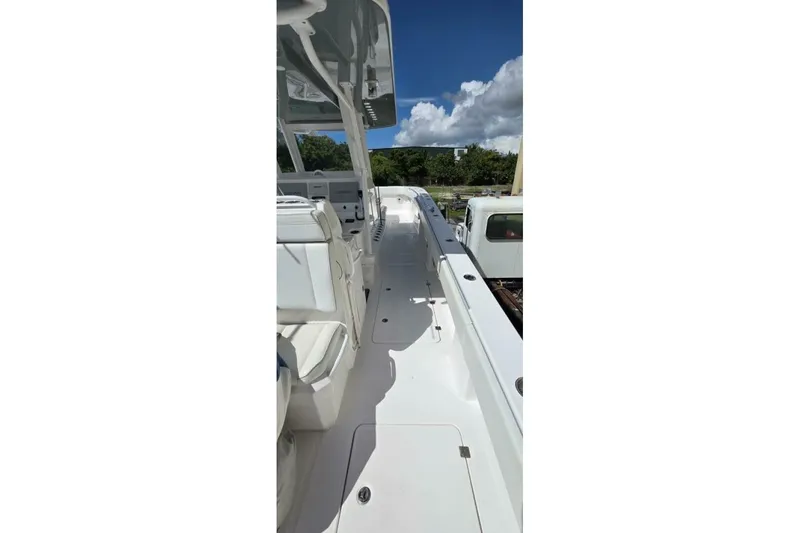Slide: The Image of 2020 Invincible 35 Catamaran deck view under clear blue sky. - 6