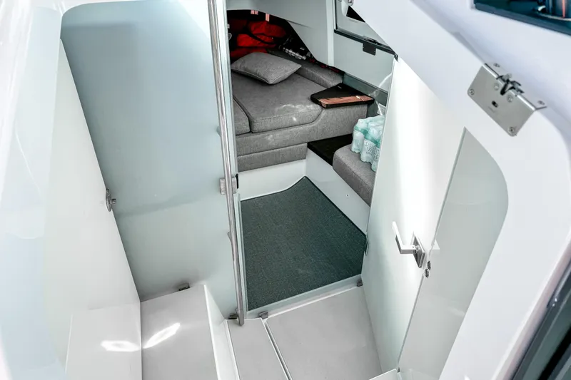 Slide: The Image of 2024 Axopar 37XC CROSS CABIN interior with modern seating and sleek design. - 15