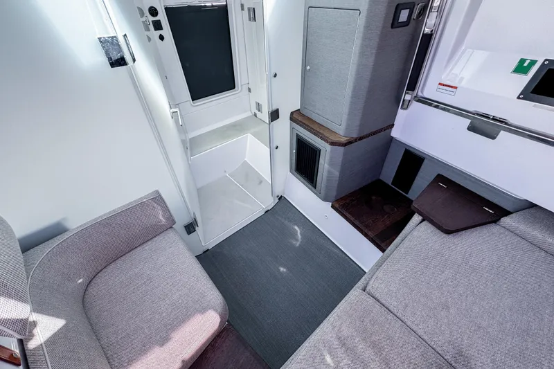 Slide: The Image of 2024 Axopar 37XC CROSS CABIN interior with modern seating and sleek design. - 18