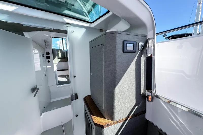 Slide: The Image of 2024 Axopar 37XC CROSS CABIN interior with modern design and natural lighting. - 19