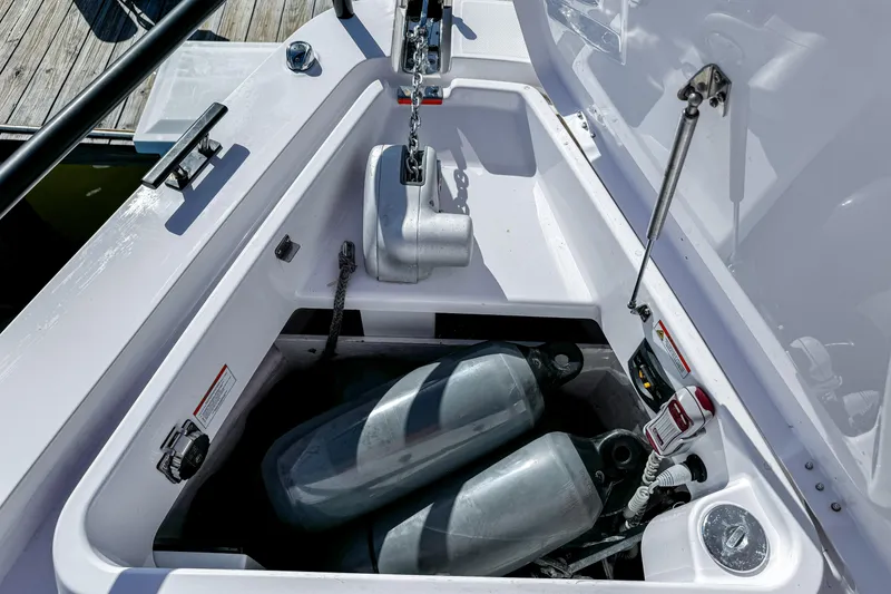 Slide: The Image of 2024 Axopar 37XC CROSS CABIN anchor storage with fenders and equipment. - 21