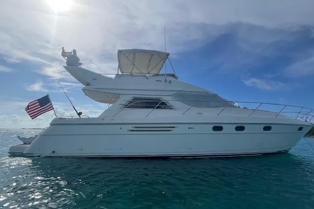 The Image of 1998 Viking Princess 50 Sport Cruiser yacht on clear blue water. - 0