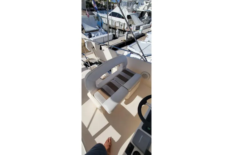 Slide: The Image of 1998 Viking Princess 50 Sport Cruiser with striped seating and teak deck. - 10