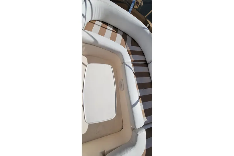 Slide: The Image of 1998 Viking Princess 50 Sport Cruiser yacht interior with seating and helm, docked at marina. - 13