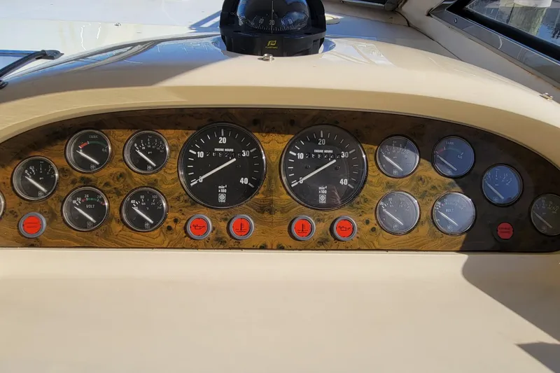 Slide: The Image of Luxurious interior of 1998 Viking Princess 50 Sport Cruiser with plush seating and elegant table. - 20