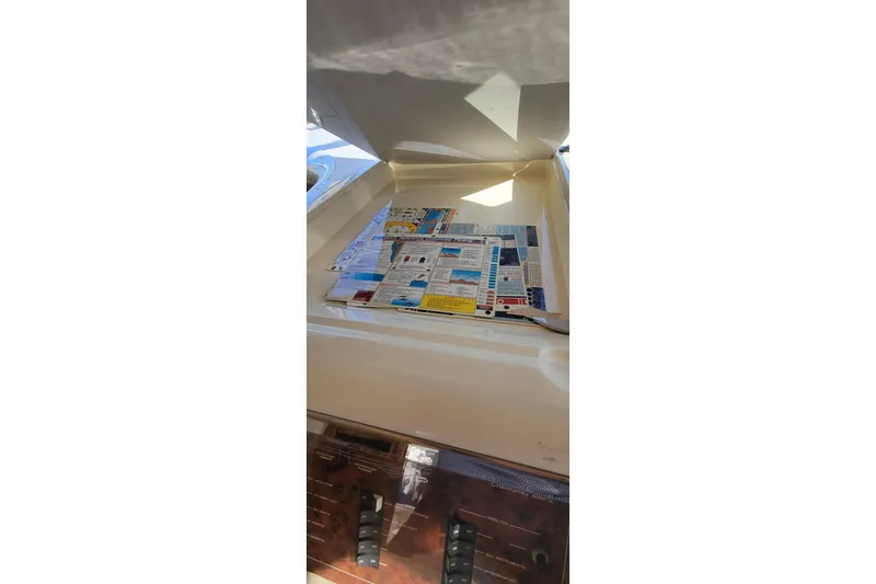 Slide: The Image of Luxurious interior of 1998 Viking Princess 50 Sport Cruiser with elegant seating and table. - 23