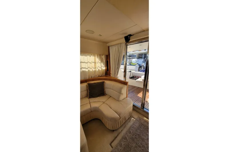 Slide: The Image of 1998 Viking Princess 50 Sport Cruiser kitchen with modern appliances and wooden cabinetry. - 27