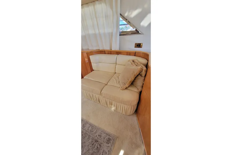 Slide: The Image of Interior of 1998 Viking Princess 50 Sport Cruiser with kitchen and seating area. - 29