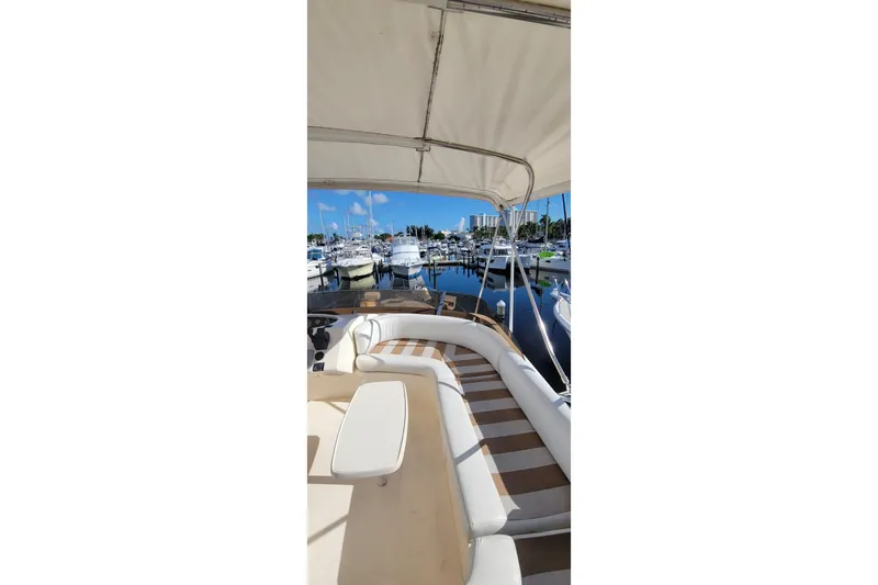 Slide: The Image of 1998 Viking Princess 50 Sport Cruiser kitchen with wood cabinetry and modern appliances. - 3