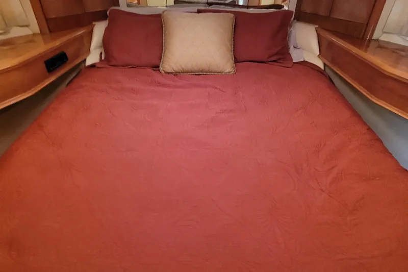 Slide: The Image of 1998 Viking Princess 50 Sport Cruiser bathroom with sink, mirror, toilet, and shower. - 35