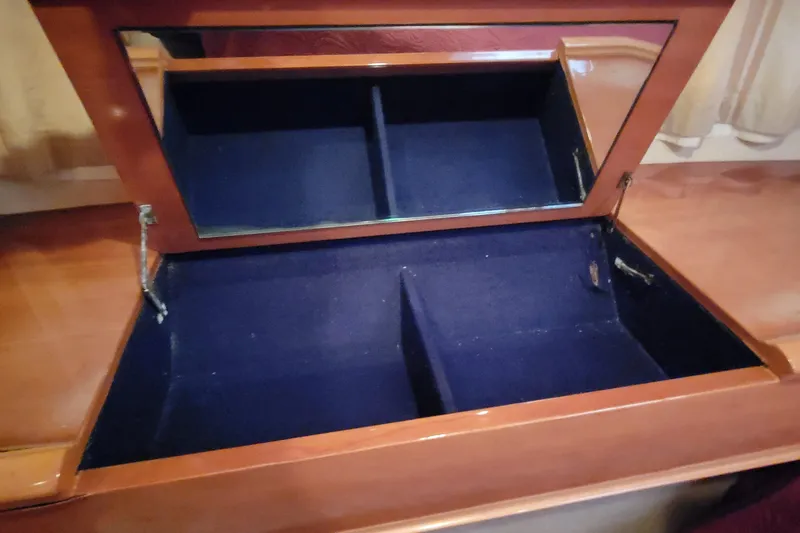 Slide: The Image of Cozy cabin interior of 1998 Viking Princess 50 Sport Cruiser with elegant wood finish. - 37