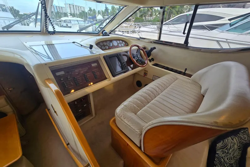 Slide: The Image of Interior of 1998 Viking Princess 50 Sport Cruiser with helm and seating area. - 47