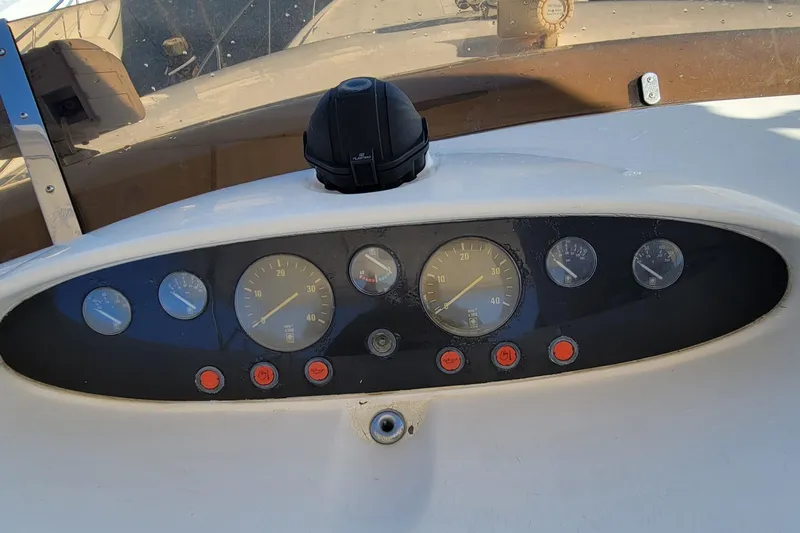 Slide: The Image of Dashboard of a 1998 Viking Princess 50 Sport Cruiser with gauges and controls. - 50