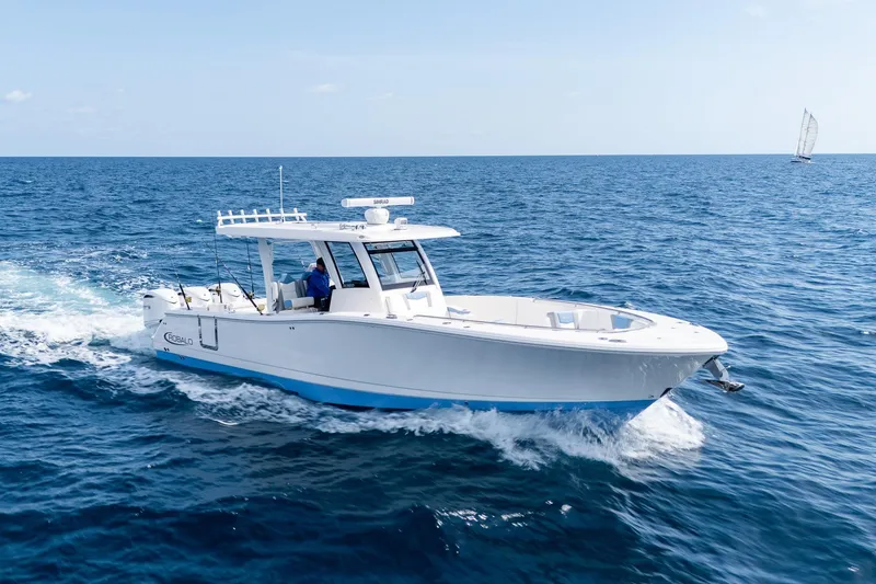 The Image of 2024 Robalo R360 Center Console boat cruising on open ocean waters. - 1