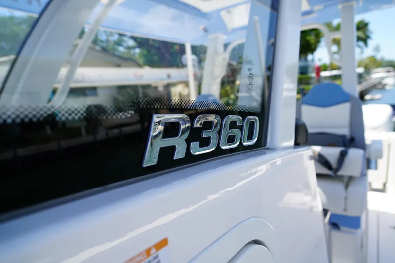 Slide: The Image of 2024 Robalo R360 Center Console boat with sleek design and modern features. - 12
