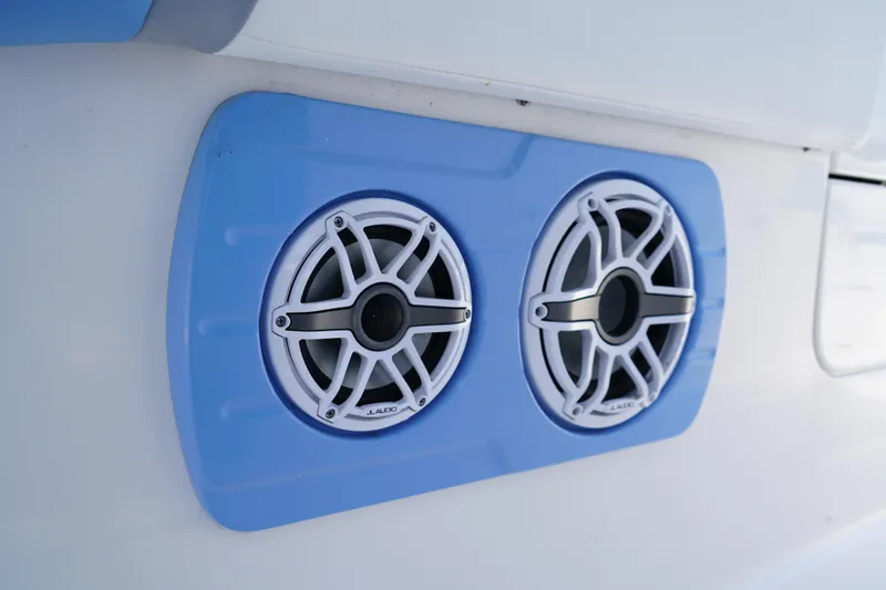 Slide: The Image of 2024 Robalo R360 Center Console boat speakers with blue trim. - 24