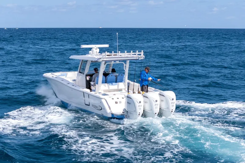 Slide: The Image of 2024 Robalo R360 Center Console boat cruising on open ocean waters. - 4