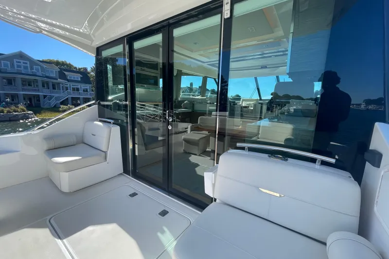 Slide: The Image of Luxury Tiara 53C yacht interior with sleek seating and glass doors, 2020 model. - 11